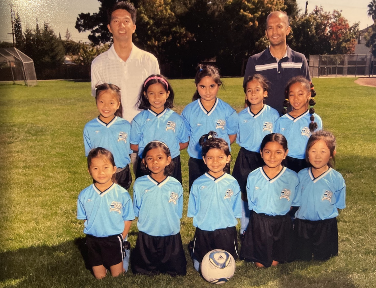 Senior and right fielder Manvika Gopalasetty  (First row second from the left) poses with the AYSO Region 35 girls soccer team at Stevens Creek Park. Photo courtesy of Manvika Gopalasetty | Used with permission
